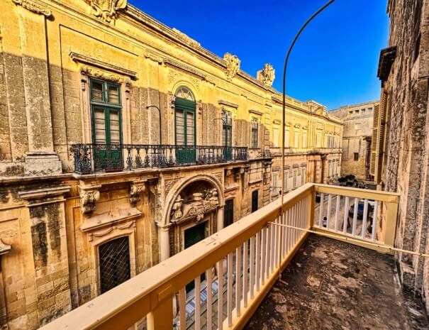 A street view from a large balcony