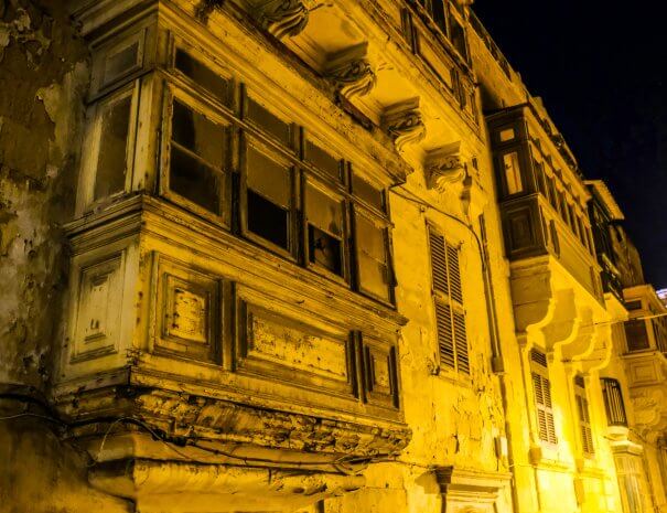 An old balcony at night in Valletta