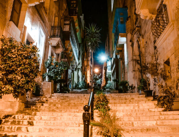 An old street at night in Valletta, Malta, with steps leading upwards