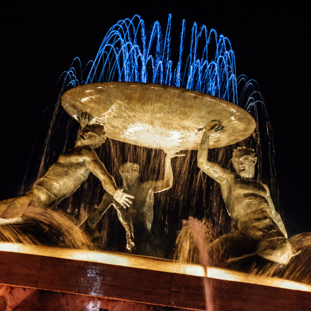 The Triton Fountain in Valletta, lit up at night
