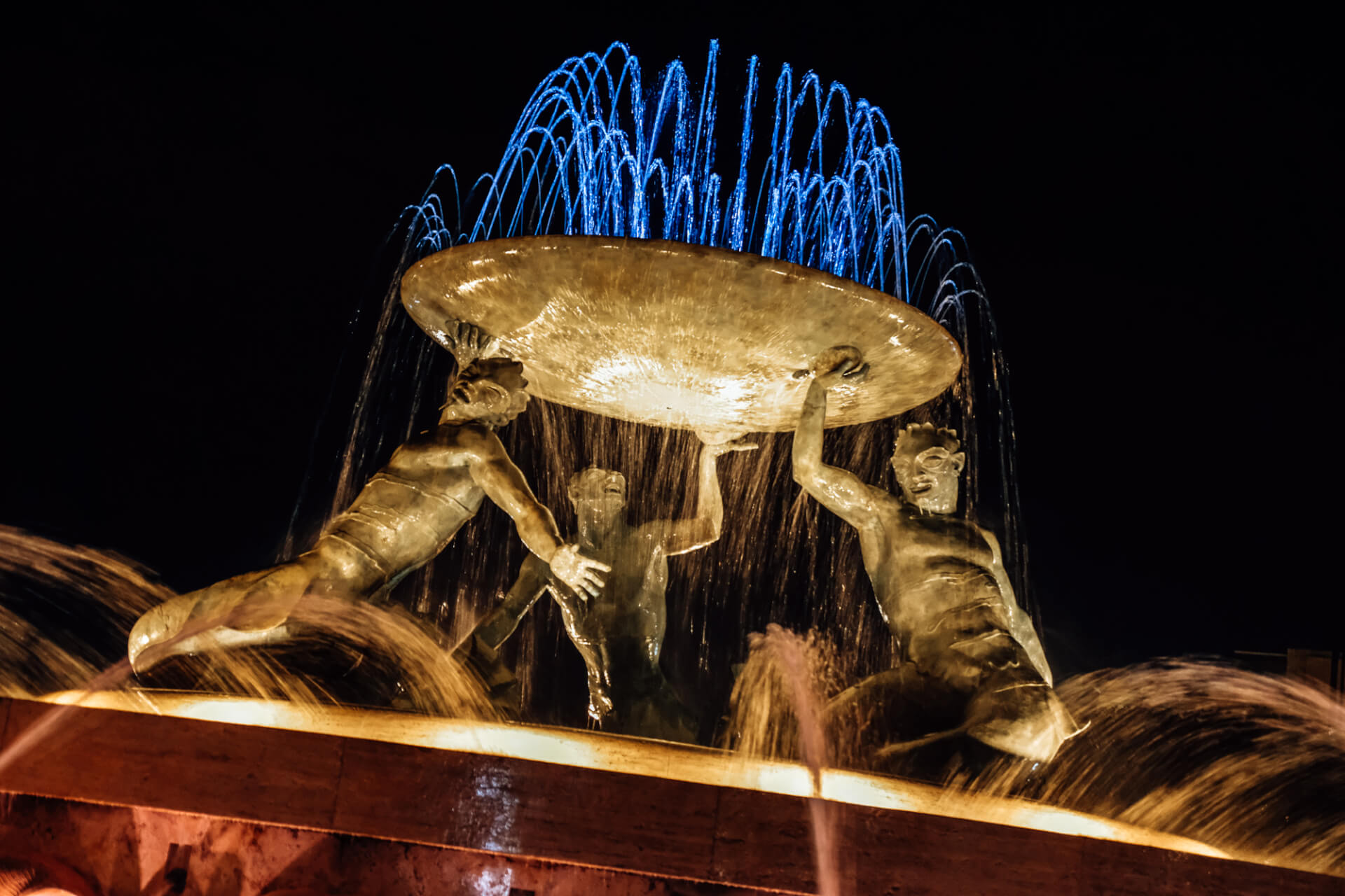 The Triton Fountain in Valletta, lit up at night