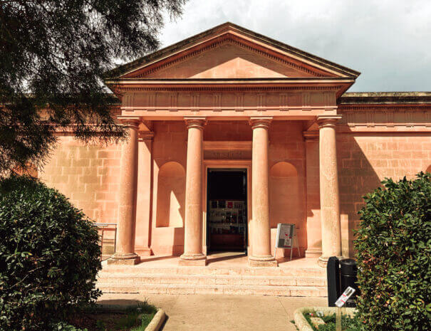 The entrance to the Domus Romana, showing a neoclassical design of four columns