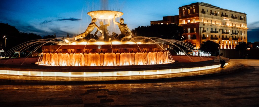 The Triton Fountain at night